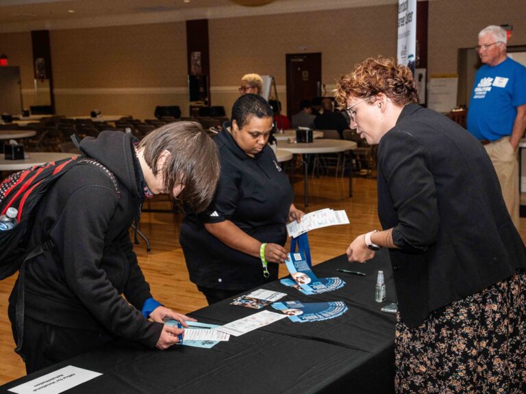 Young people completing job applications at the 2025 Coalition Forward Job Fair.